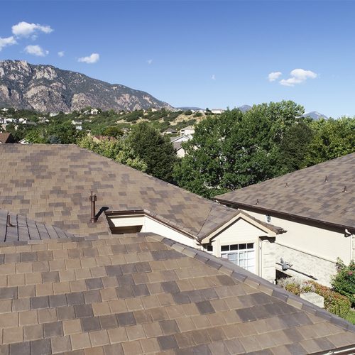 A close-up of a majestic DaVinci roof amidst the majestic mountains.