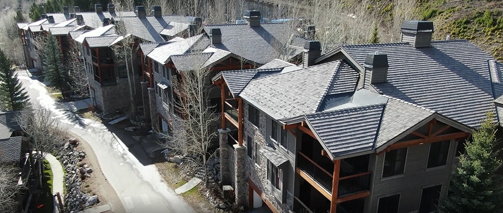Fire-resistant shake roofing give residents peace of mind in this condo community located near a national forest. 