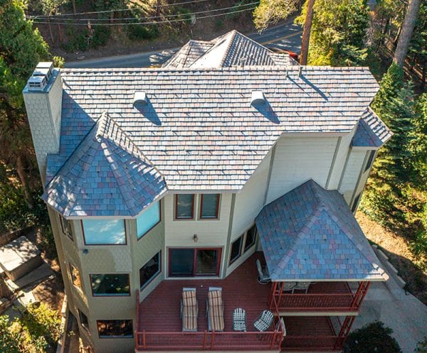 This colorful synthetic slate combines with the roof's various shapes and angles to complement the entire home. 