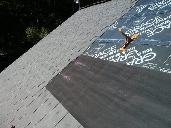 Eight years later, roofer Tim Carter is still pleased with his durable synthetic slate roof.