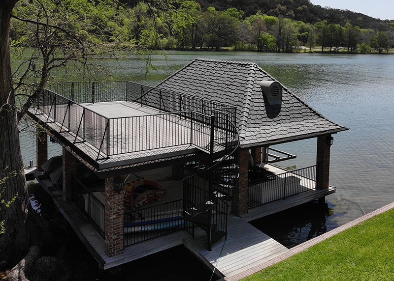The low-maintenance composite slate roof on this Lake Travis boathouse means more time for leisure. 