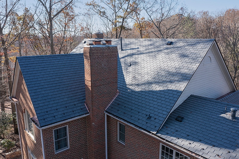 The switch to composite slate also resulted in new metal snow guards that accent the roof and ensure safer snow disbursement after big storms. 