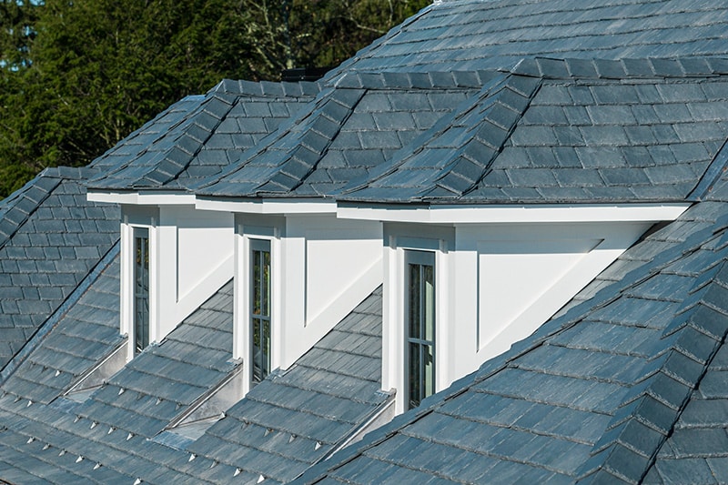 This custom home's composite roof in DaVinci Slate added to its elegant curb appeal. 