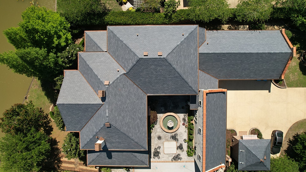 Replacing their old roof with Province Slate enabled these homeowners to enjoy their home all over again thanks to its synthetic slate roofing transformation.