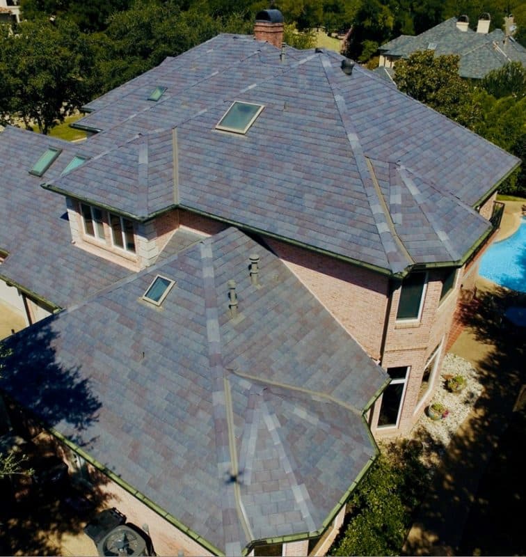 Thanks to their new HOA approved synthetic slate roof by DaVinci, these homeowners enjoy the beauty of natural slate without the maintenance. 