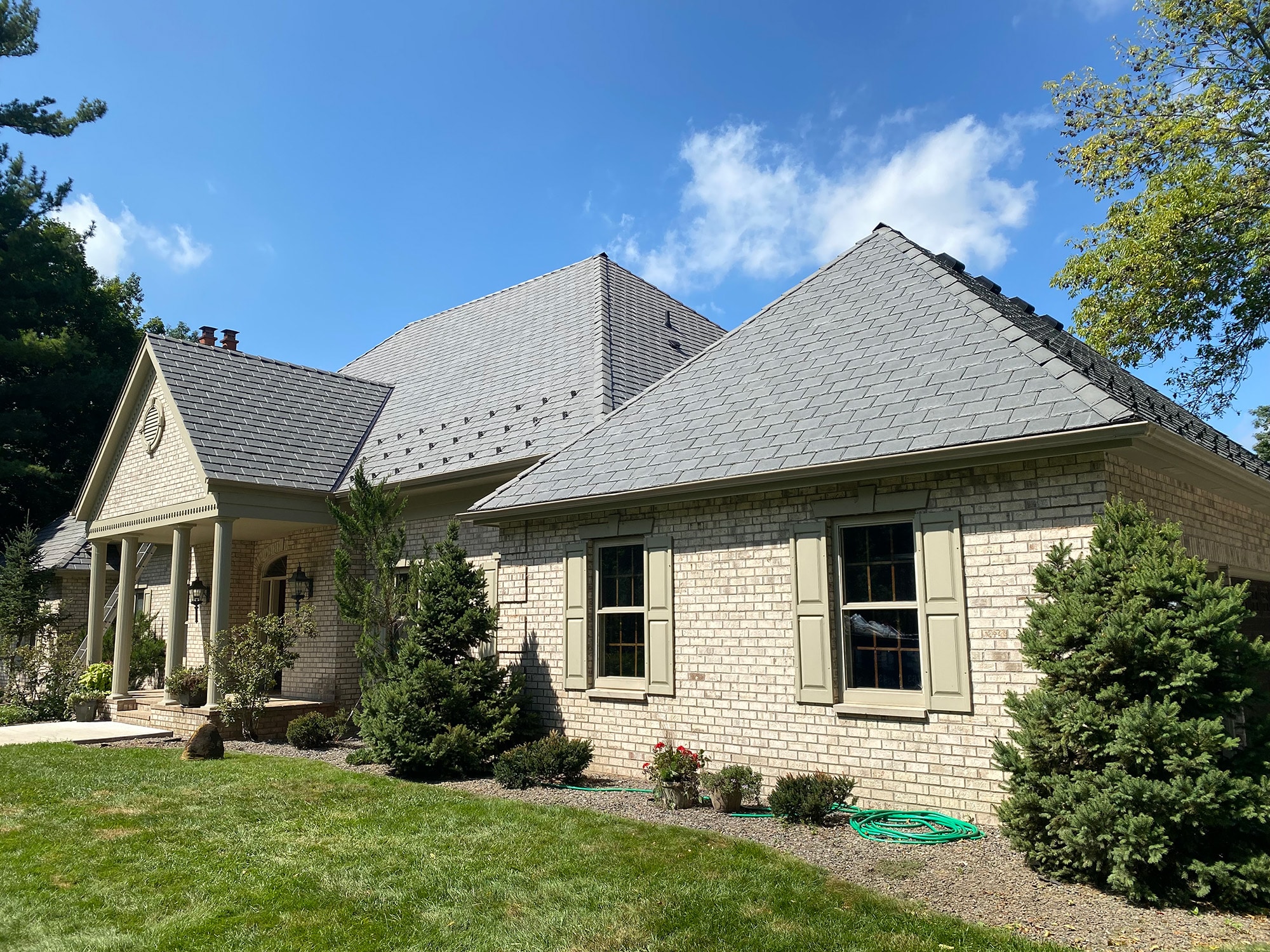 Switching to impact-resistant composite roofing gave this homeowner peace of mind and improved their home's curb appeal in the process. 